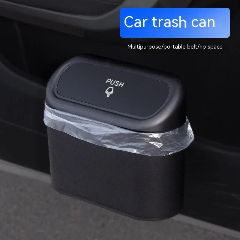Mini Car Trash Can with lid, leakproof and compact design, perfect for cars, home, and office use.  Compact Mini Car Trash Can placed in a car cup holder, highlighting its space-saving design.