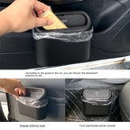 Mini Car Trash Can with lid, leakproof and compact design, perfect for cars, home, and office use.  Compact Mini Car Trash Can placed in a car cup holder, highlighting its space-saving design.