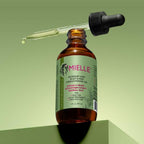 Mielle Rosemary Mint Hair Oil – Biotin-infused treatment for hair growth and scalp nourishment in a 2 fl oz (59ml) bottle.